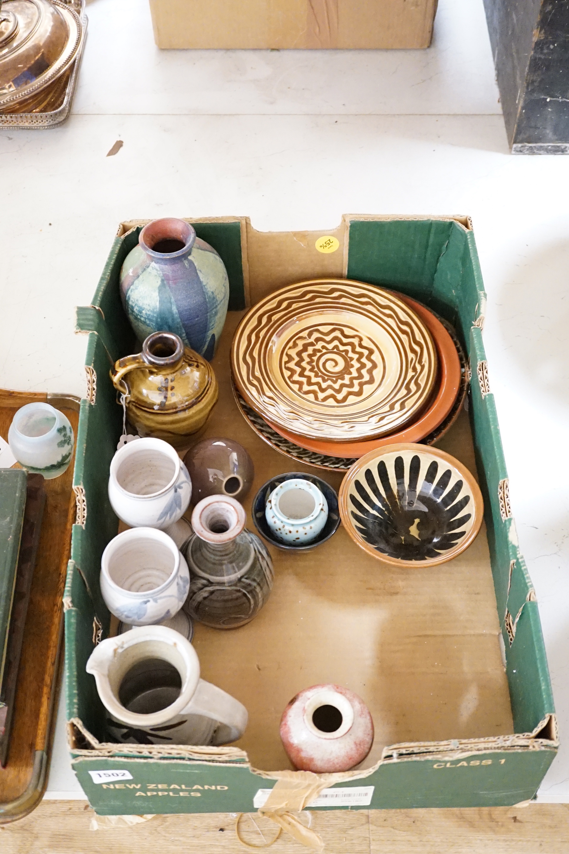 A group of European and Japanese studio pottery dishes, bowls and vases including a Boscastle R Irving plate, largest 26cm in diameter (17)